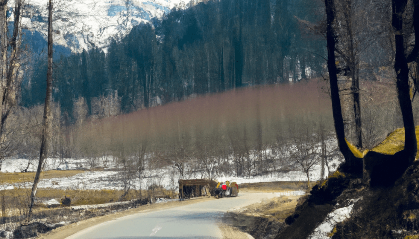 Scenic view of Gulmarg and Pahalgam, two of the best places to visit in Kashmir, featuring snow-capped mountains, lush valleys, and adventure activities.