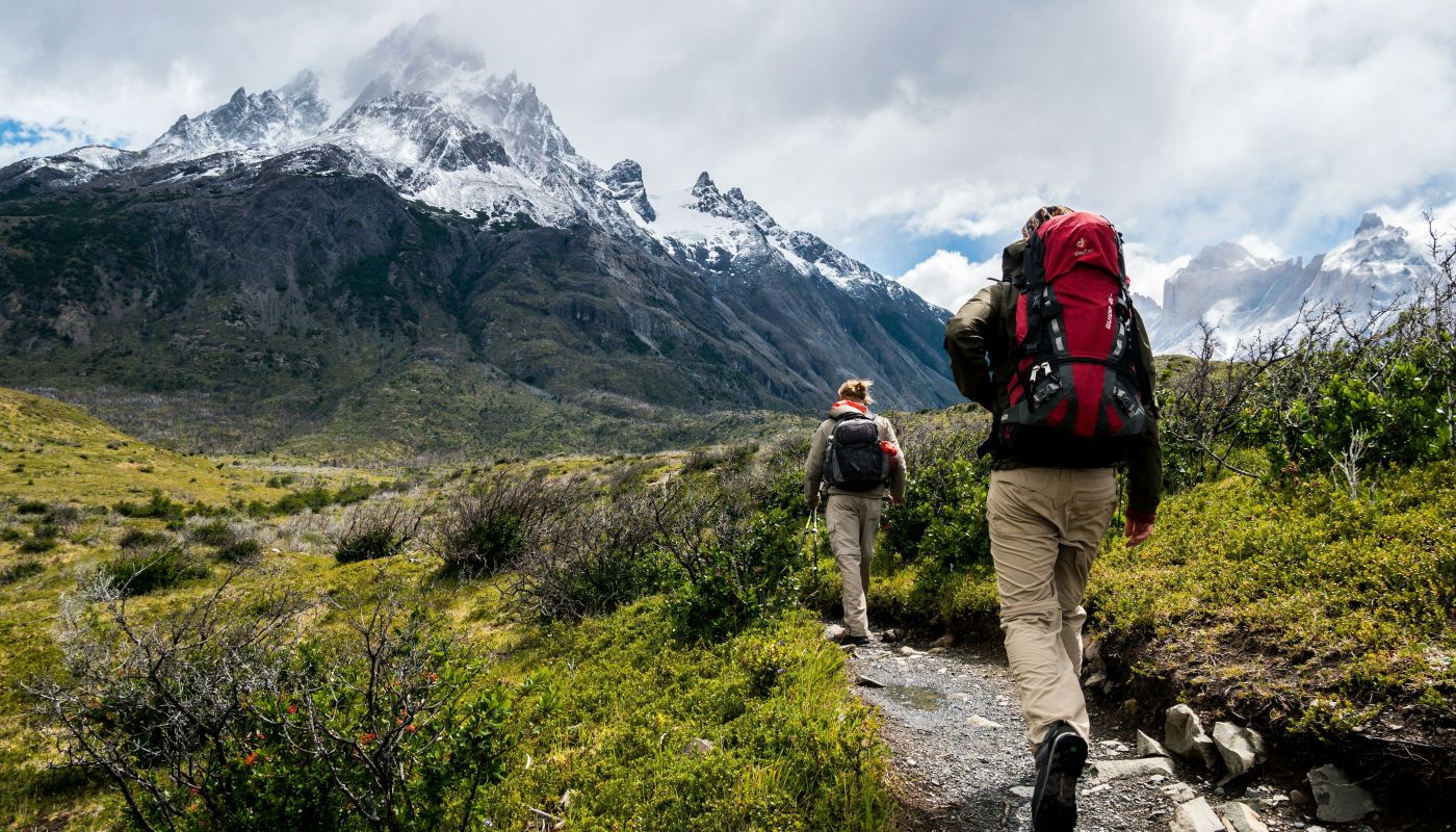 Beginner trekker exploring scenic trails in India surrounded by mountains and nature.
