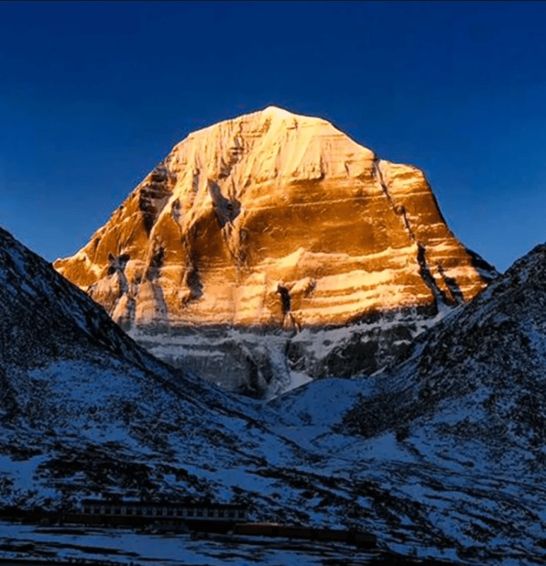 Pilgrims at Mount Kailash and Lake Mansarovar during the sacred yatra, surrounded by snow-capped peaks and spiritual serenity.