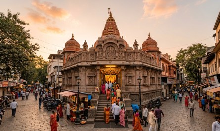 Wide shot of Dagdusheth Halwai Ganpati temple facade during early morning golden hour, devotees entering, warm natural l