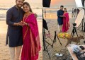 Split-screen couple photo: Instagram-perfect pose on left, behind-the-scenes setup chaos on right, golden hour beach set