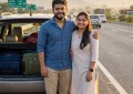 Young Indian couple standing beside their car on NH48 highway at sunrise, excited expressions, road trip mood, golden ho