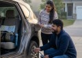 Couple checking car tire pressure and fuel in early morning light before Maharashtra hill station road trip, natural can