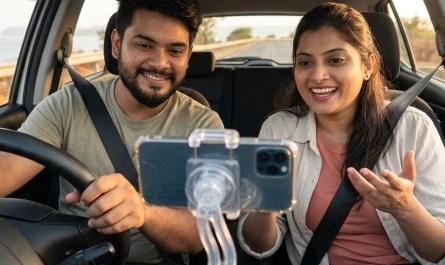 Couple filming travel vlog inside car with phone mount, natural dashboard view, candid unposed expression, warm afternoo