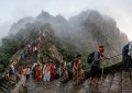 **Image Prompt 2:** Early morning Girnar mountain steps winding upward, stone staircase with pilgrims climbing, morning